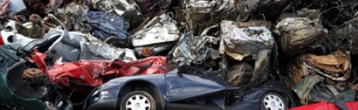 Piles of crushed cars at a metal recycling site in Belfast, Northern Ireland. Photograph: Alamy